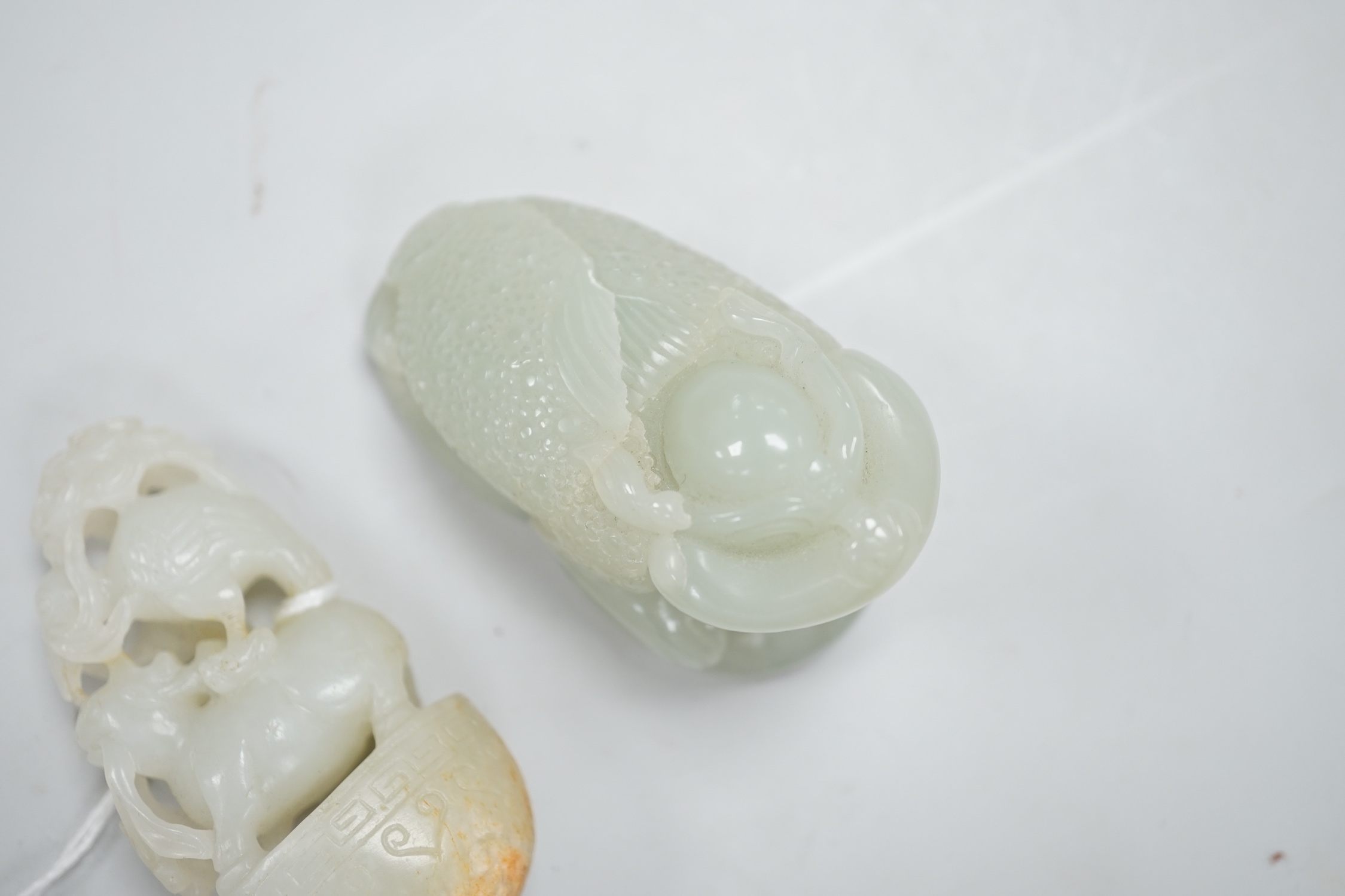 A Chinese green jade figure of a three legged toad and a Chinese pale celadon jade group of a crane and a deer in archaic style, toad carving 6.5cm long (2)